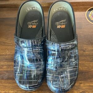 Dansko Black and Blue patent leather clogs